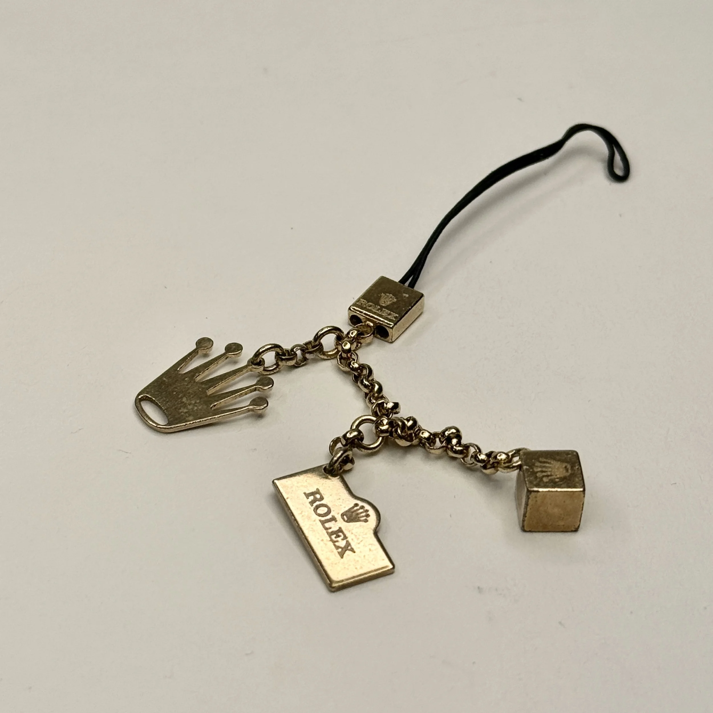 Vintage Rolex Gold Charm Accessory with Box – Collectible Tri-Charm